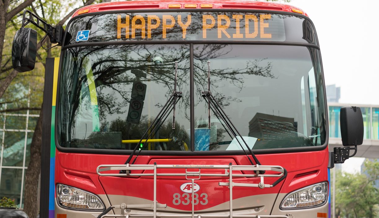 Bus displaying Happy Pride